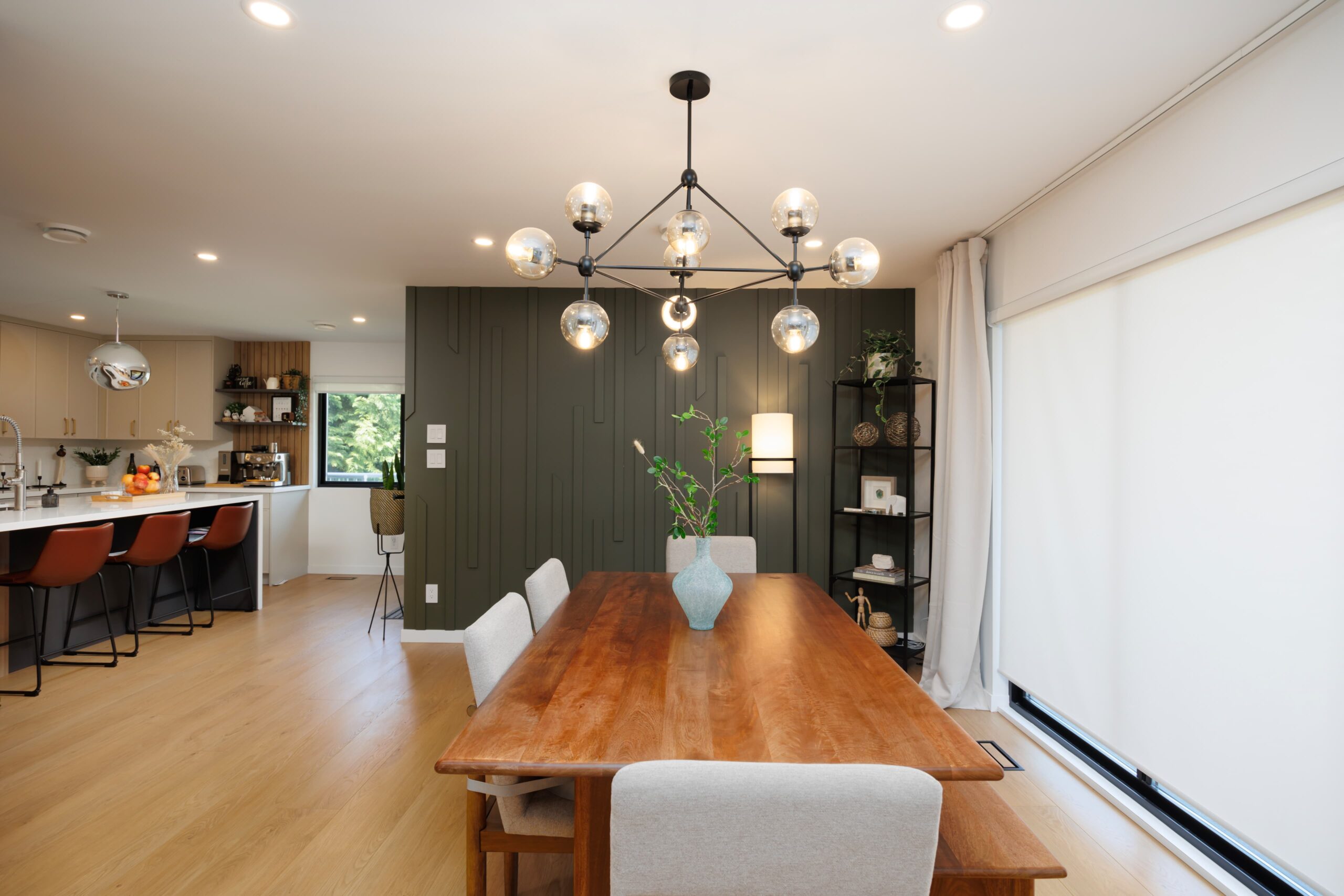 Modern open-concept dining room and kitchen in a custom home in Greater Vancouver